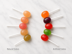 Side-by-side comparison of lollipops colored by fruit and vegetable extracts versus lollipops with artificial colors